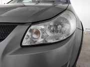 Suzuki SX4 original Scheinwerfer links Halogen mit LWR trüb vergilbt BJ2009